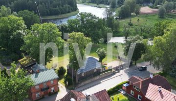 A two-story log house near the banks of the Gauja River in Valmiera
